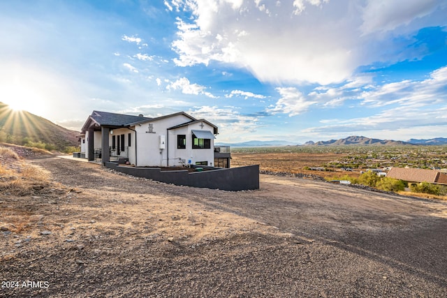 view of side of home with a mountain view