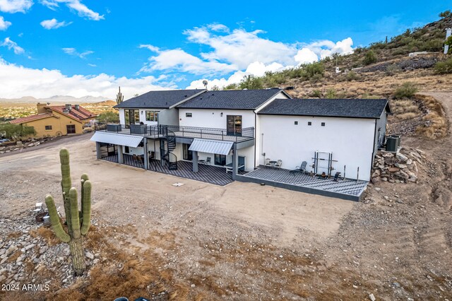 back of house featuring a mountain view