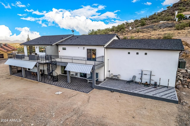 back of house featuring a patio and a mountain view