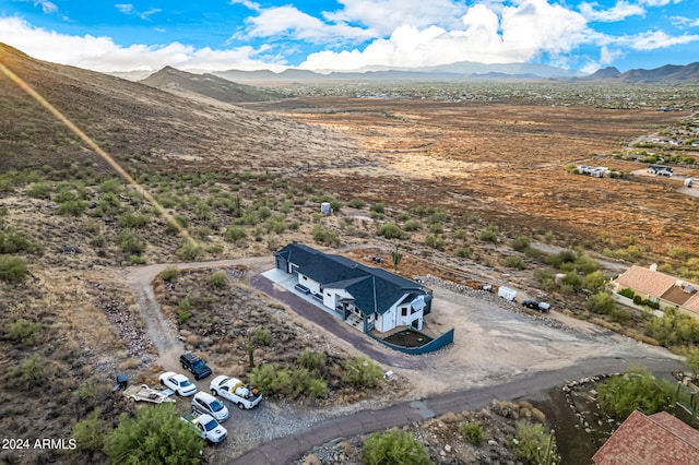 birds eye view of property with a mountain view