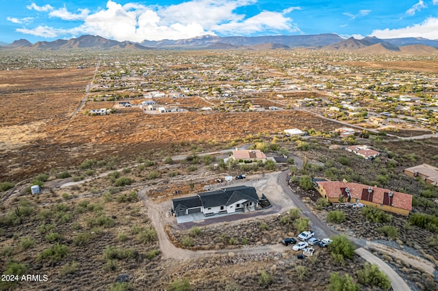 birds eye view of property featuring a mountain view