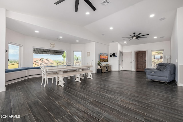 dining space featuring lofted ceiling, dark hardwood / wood-style flooring, and ceiling fan