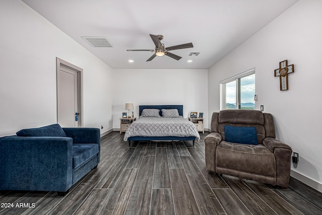 bedroom with ceiling fan and dark hardwood / wood-style floors