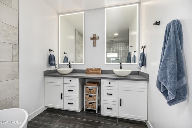 bathroom with walk in shower and vanity