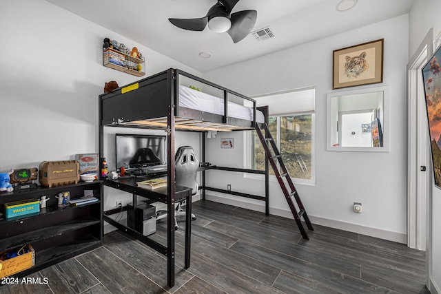 bedroom featuring dark hardwood / wood-style floors and ceiling fan