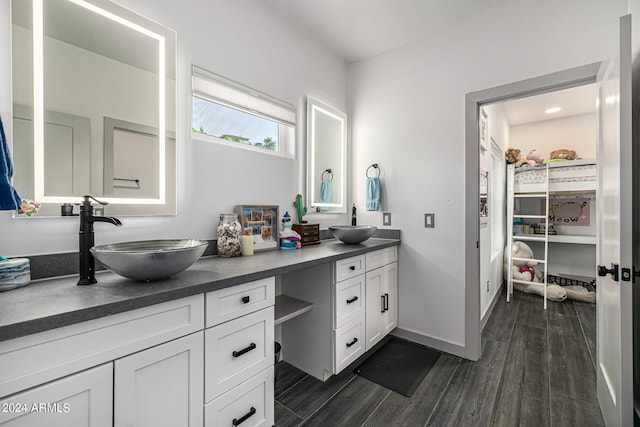 bathroom with hardwood / wood-style floors and vanity