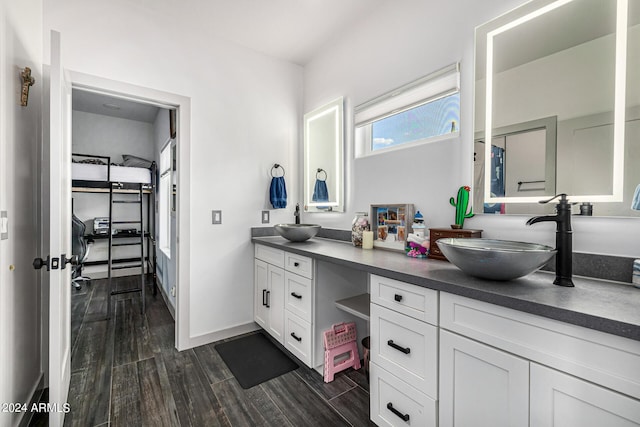 bathroom with hardwood / wood-style flooring and vanity