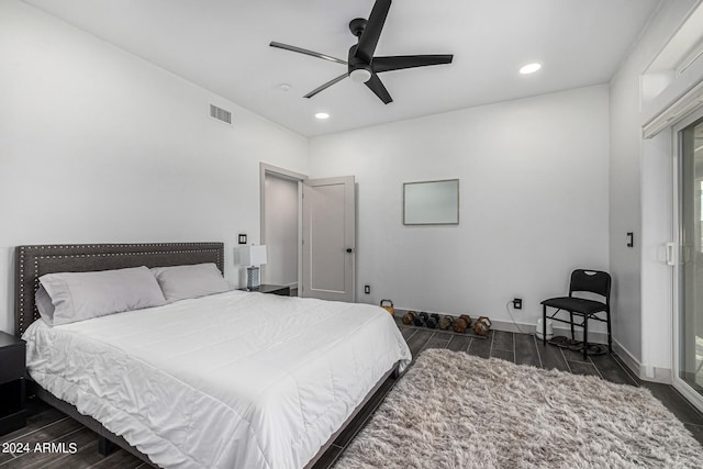 bedroom featuring dark hardwood / wood-style flooring and ceiling fan