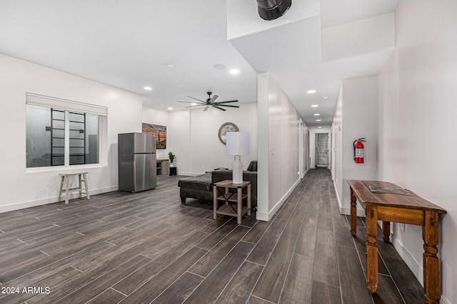 interior space with ceiling fan and dark wood-type flooring