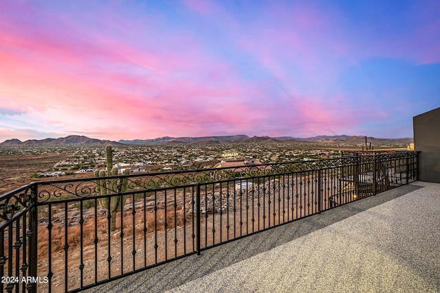 balcony at dusk with a mountain view