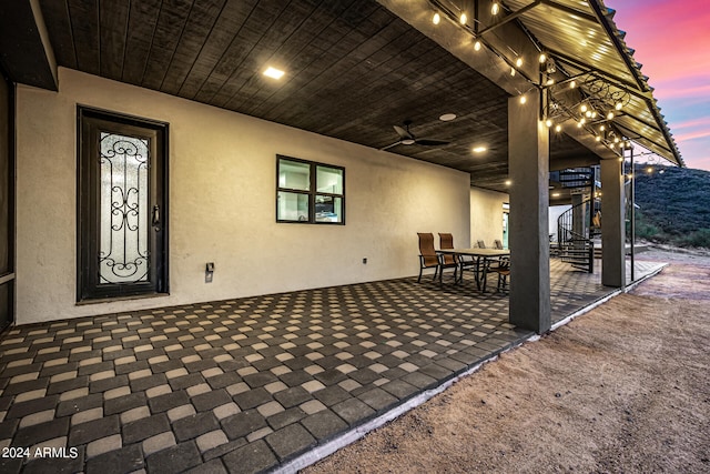 patio terrace at dusk with ceiling fan