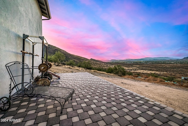 patio terrace at dusk with a mountain view