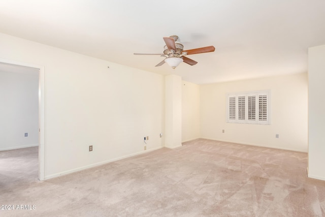 carpeted empty room with ceiling fan