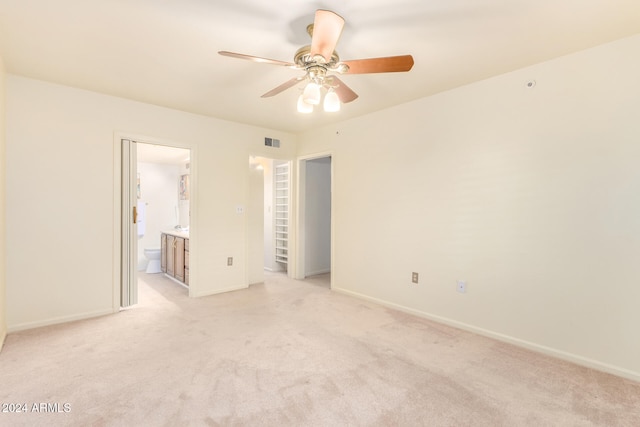 carpeted empty room with ceiling fan