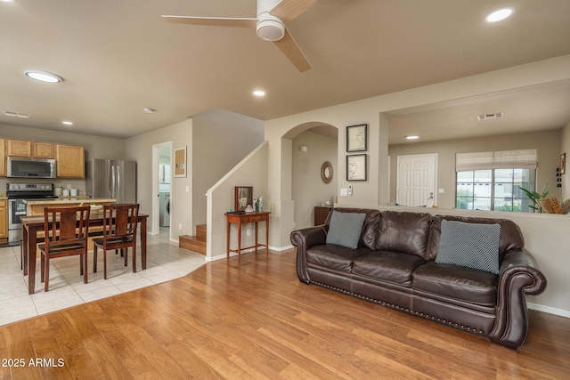 living area with visible vents, recessed lighting, light wood-style floors, and ceiling fan