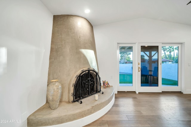 living room with lofted ceiling and wood-type flooring