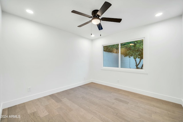 unfurnished room featuring ceiling fan and light hardwood / wood-style floors