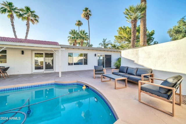 view of swimming pool with a patio and an outdoor hangout area