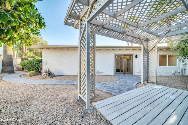 exterior space with french doors and a pergola