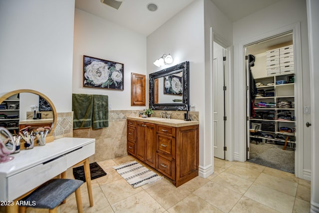 22406 S 173rd Way, Gilbert, AZ 85298 - full bath with vanity, a walk in closet, tile walls, and tile patterned flooring