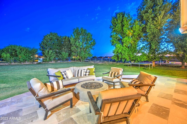 22406 S 173rd Way, Gilbert, AZ 85298 - patio at night with a trampoline, an outdoor living space with a fire pit, and a patio
