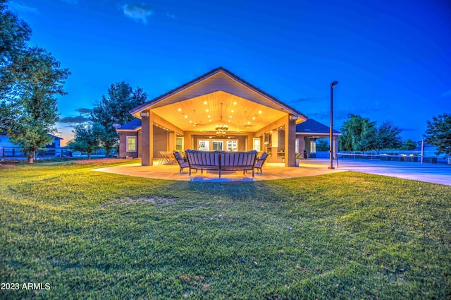 22406 S 173rd Way, Gilbert, AZ 85298 - back of house at dusk with ceiling fan and a patio