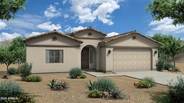 mediterranean / spanish-style house featuring concrete driveway, an attached garage, a tile roof, and stucco siding