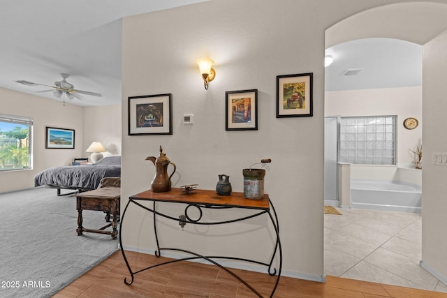 3018 E Vernon St, Gilbert, AZ 85298 - hall with arched walkways and wood finished floors