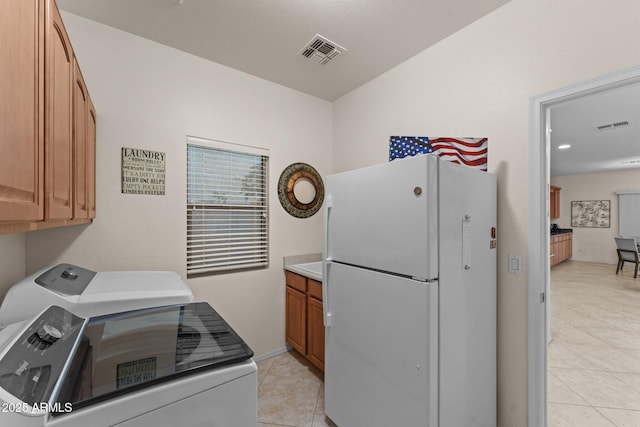 3018 E Vernon St, Gilbert, AZ 85298 - laundry room with cabinet space, washing machine and clothes dryer, and light tile patterned floors