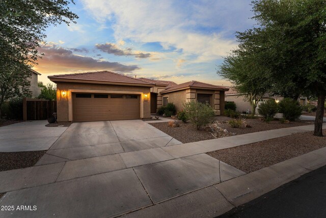 3018 E Vernon St, Gilbert, AZ 85298 - view of front facade featuring concrete driveway, stucco siding, a garage, and a tiled roof