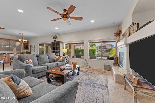 3018 E Vernon St, Gilbert, AZ 85298 - living area featuring a ceiling fan, light tile patterned floors, a chandelier, recessed lighting, and a tile fireplace