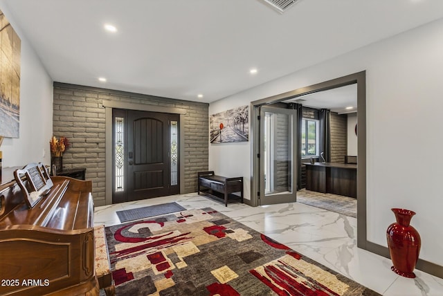 5101 E Paradise Dr, Scottsdale, AZ 85254 - entryway featuring marble tiled flooring, recessed lighting, and brick wall