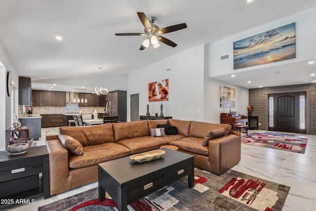 5101 E Paradise Dr, Scottsdale, AZ 85254 - living area with ceiling fan, recessed lighting, marble finish floors, lofted ceiling, and a chandelier
