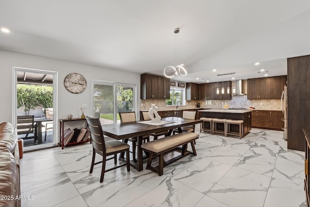 5101 E Paradise Dr, Scottsdale, AZ 85254 - dining space featuring light marble finish floors, recessed lighting, plenty of natural light, a chandelier, and vaulted ceiling