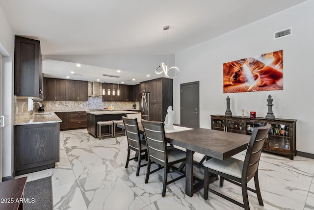 5101 E Paradise Dr, Scottsdale, AZ 85254 - dining room with light marble finish flooring and recessed lighting
