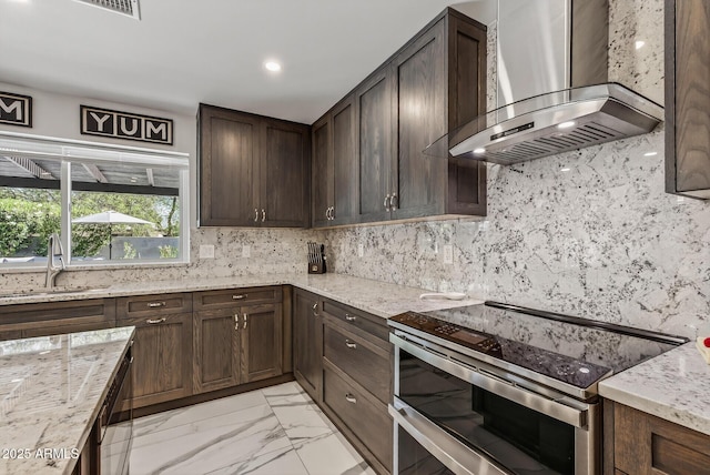 5101 E Paradise Dr, Scottsdale, AZ 85254 - kitchen with wall chimney exhaust hood, stainless steel range with electric cooktop, light stone countertops, dark brown cabinetry, and recessed lighting