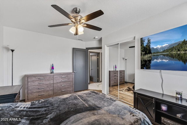5101 E Paradise Dr, Scottsdale, AZ 85254 - bedroom featuring a closet, ceiling fan, and wood finished floors
