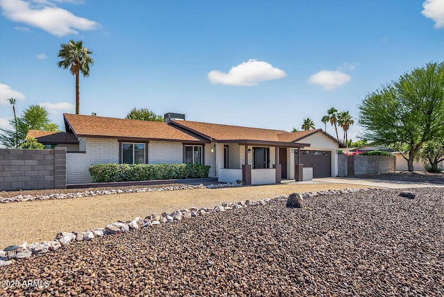 5101 E Paradise Dr, Scottsdale, AZ 85254 - ranch-style home with a garage, concrete driveway, and covered porch