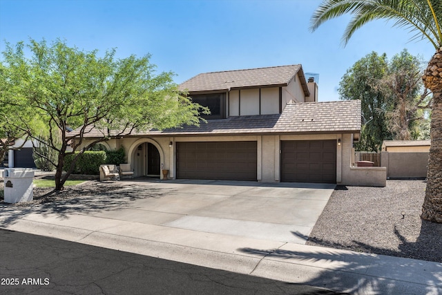 10759 N 101st St, Scottsdale, AZ 85260 - view of front of property featuring driveway, stucco siding, and a garage