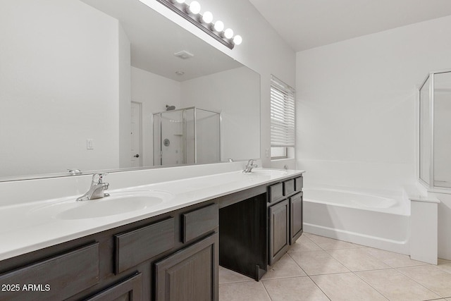 bathroom with tile patterned flooring, vanity, and separate shower and tub