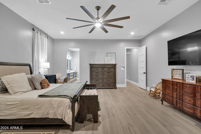 bedroom featuring recessed lighting, visible vents, light wood-style flooring, and baseboards