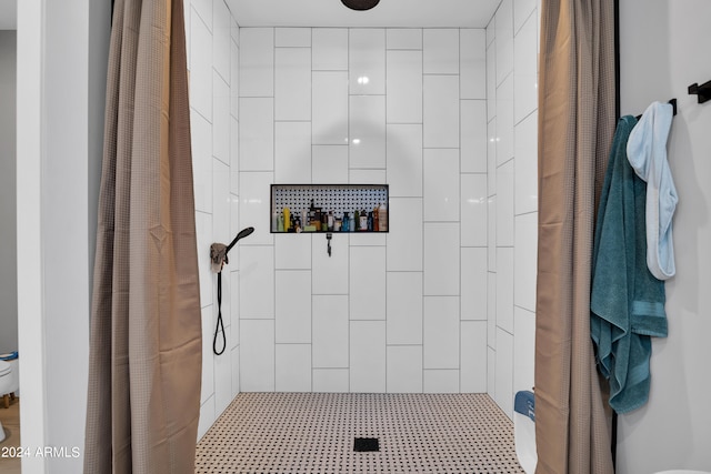 full bathroom with tiled shower