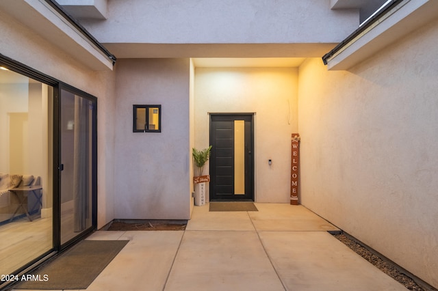 doorway to property with a patio area