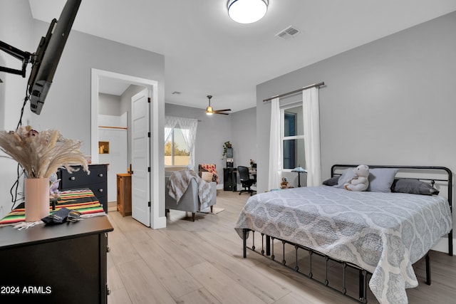 bedroom with light wood-type flooring and visible vents