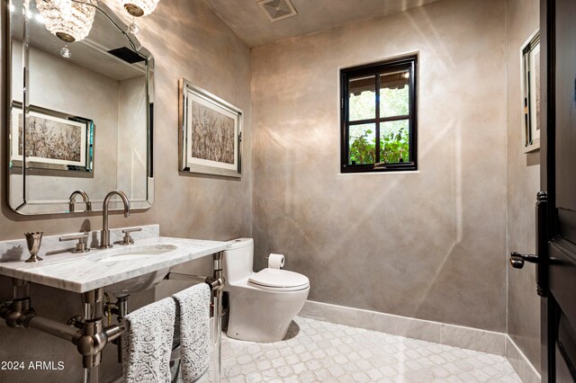 bathroom featuring toilet and sink