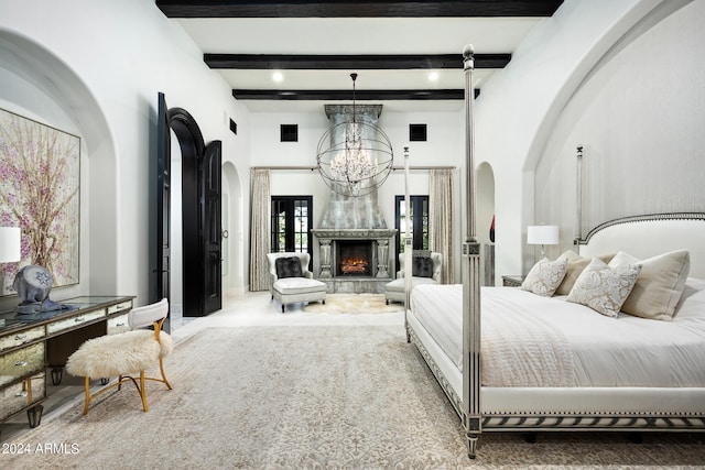 bedroom featuring beamed ceiling, a notable chandelier, and carpet floors