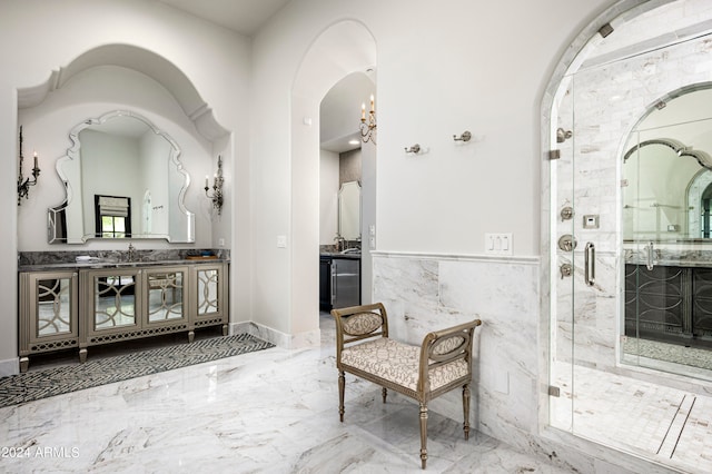 interior space featuring vanity, tile walls, and a shower with shower door