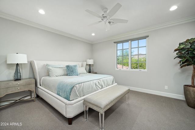 carpeted bedroom with ornamental molding and ceiling fan