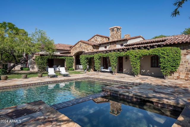 view of swimming pool with a patio