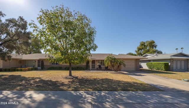 ranch-style house featuring a garage